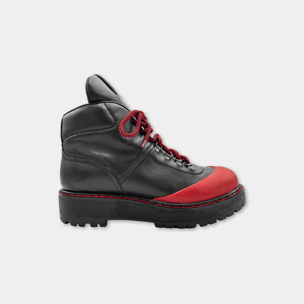 A black and red hiking boot with a red sole and red laces.