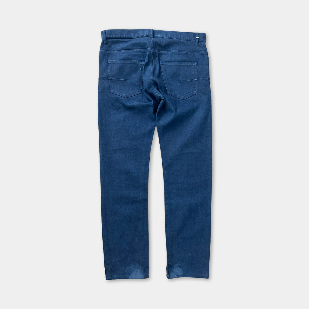 A pair of blue jeans with a dark blue color and a dark blue waistband.