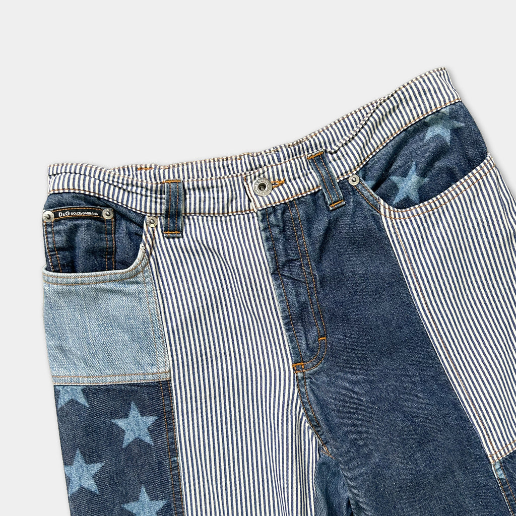 A pair of blue and white striped jeans with star patterns on the pockets.
