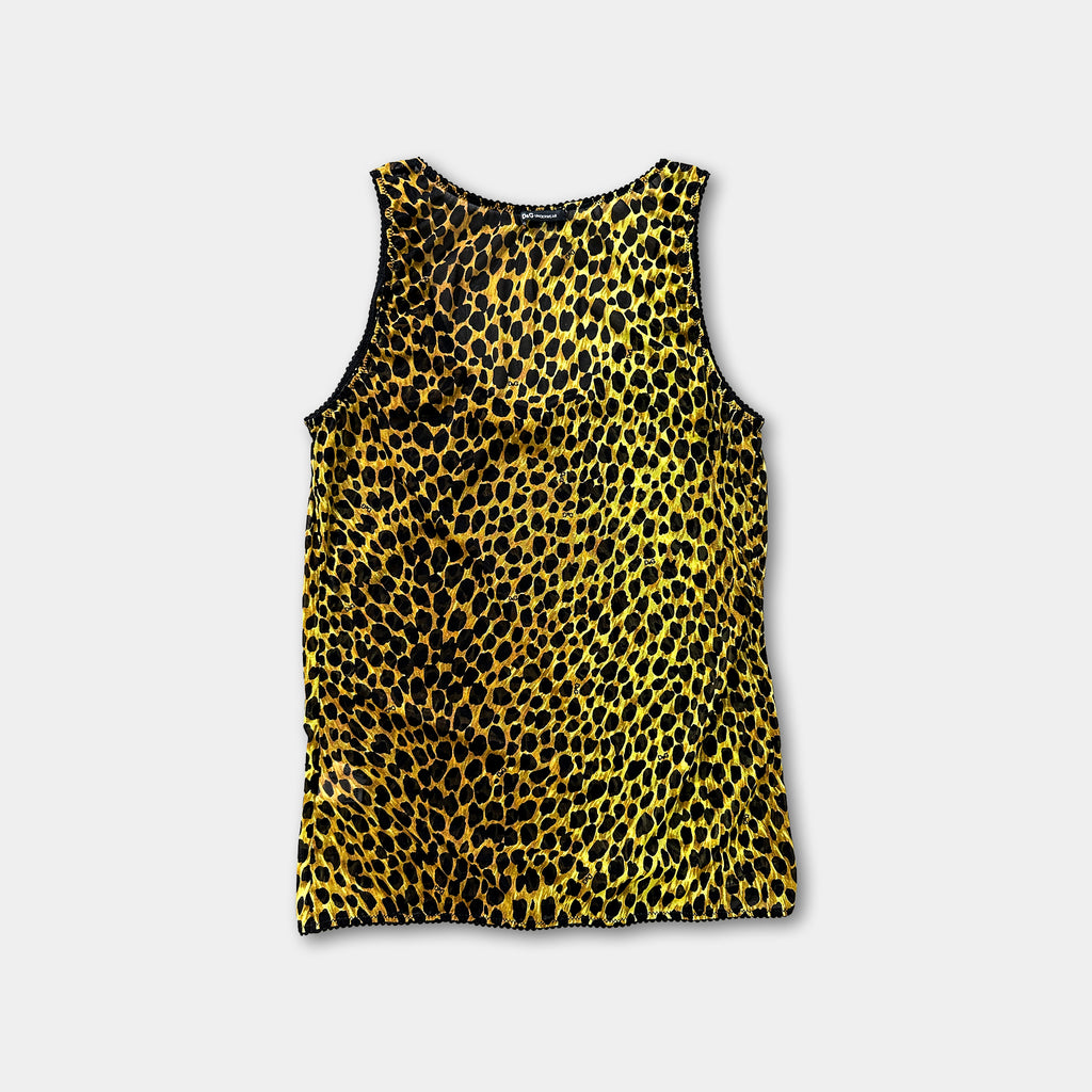 A yellow and black leopard print top is displayed against a white background.
