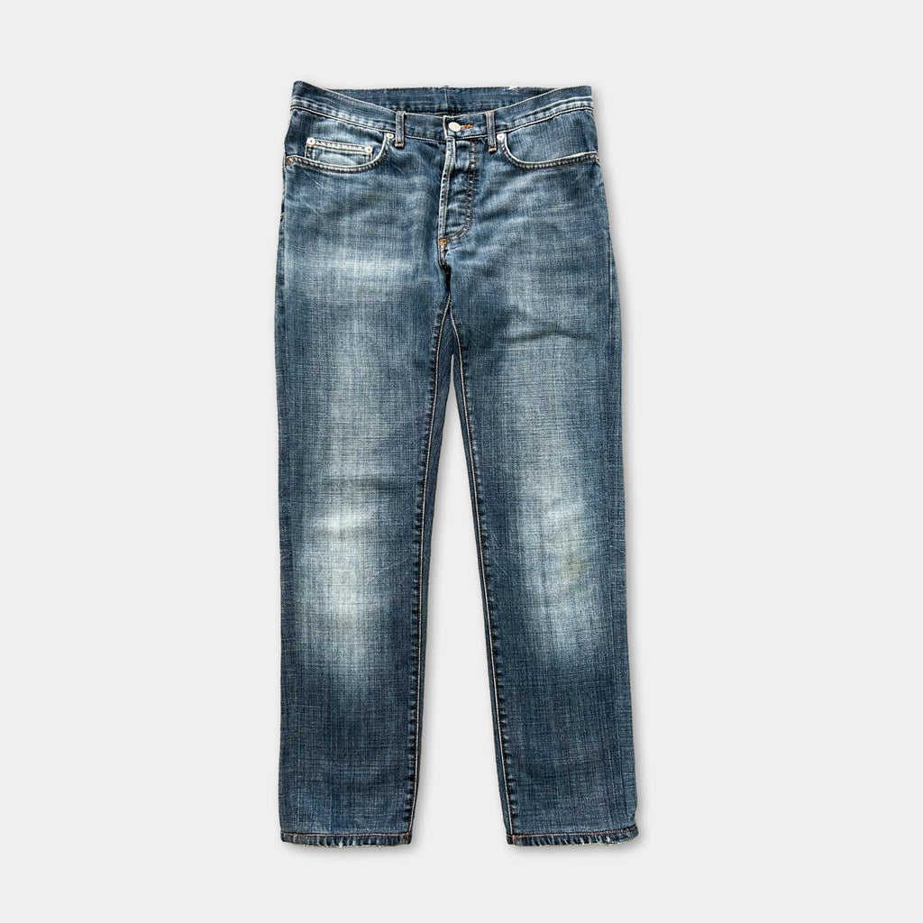 A pair of blue jeans with a faded, distressed appearance.