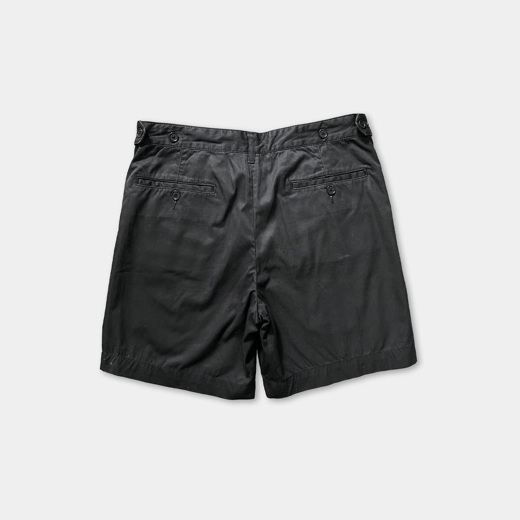 a pair of black shorts against a white background.