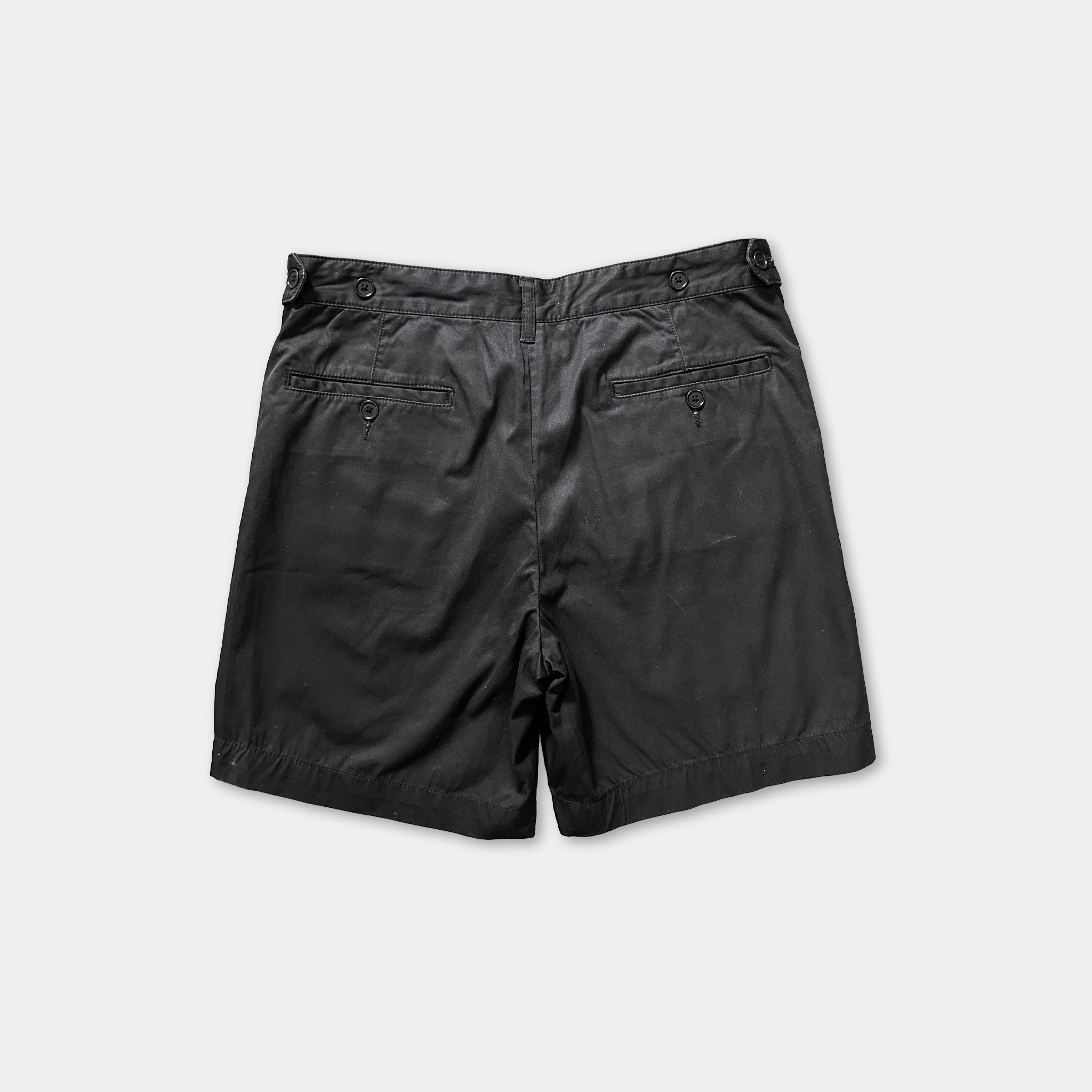 a pair of black shorts against a white background.