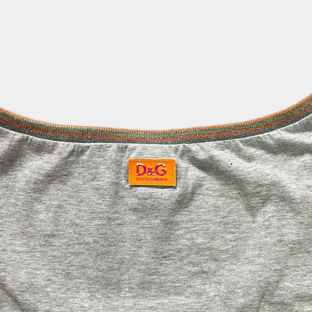 A gray T-shirt with a red and orange D&G logo on the collar.