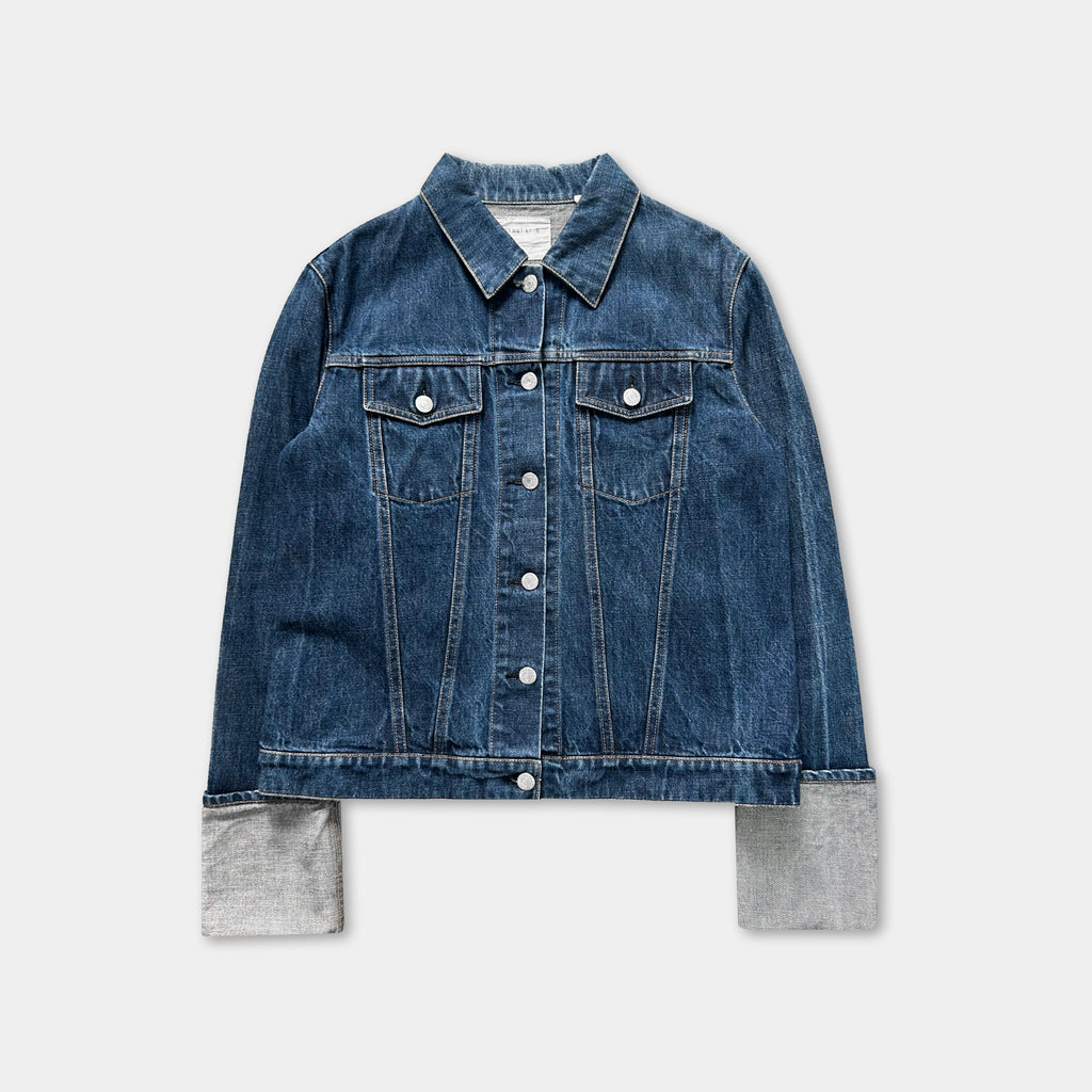 A denim jacket with a button-down front and two pockets, displayed against a white background.