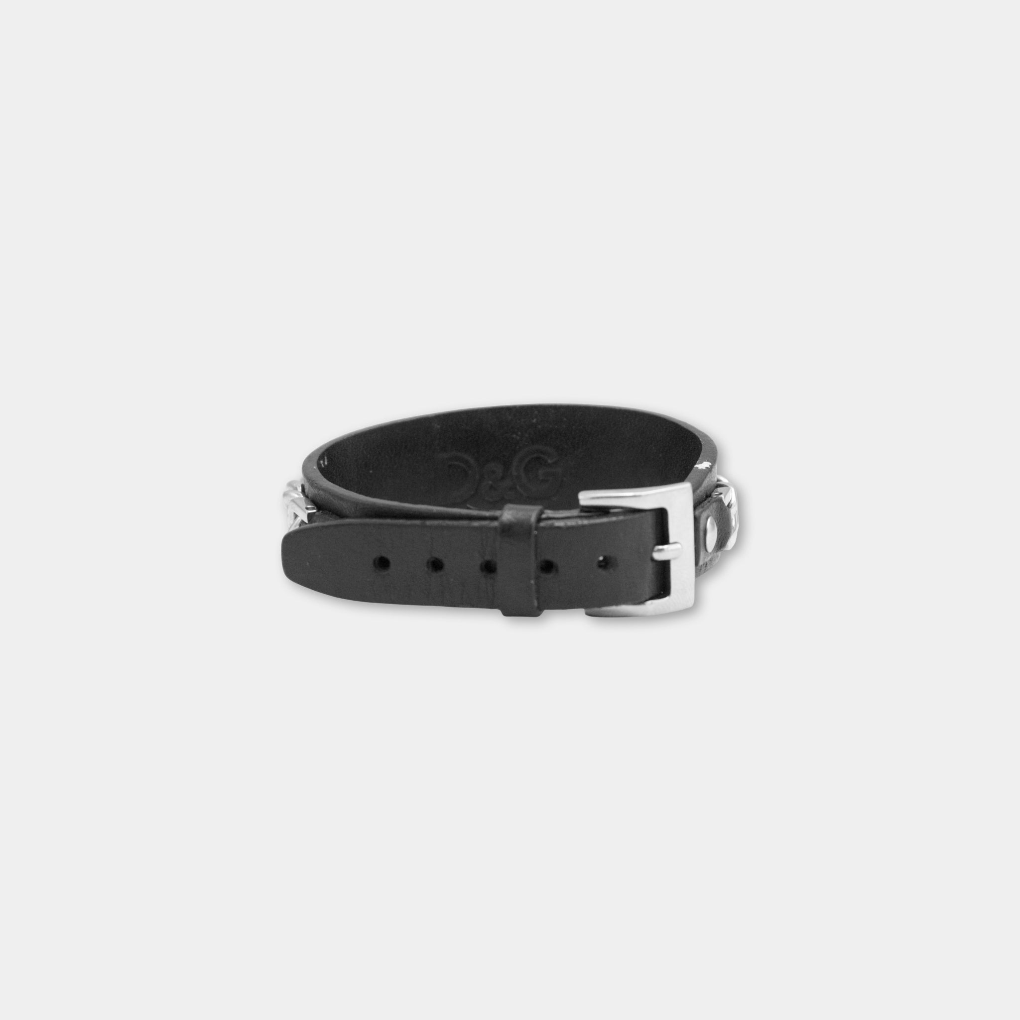 A black leather bracelet with a metal buckle.