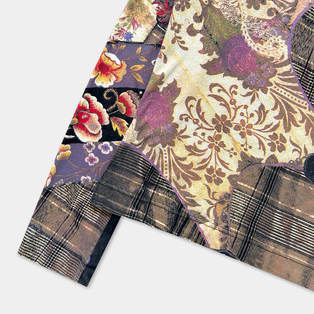 The image is a close-up view of a colorful, patterned fabric with floral and plaid designs.
