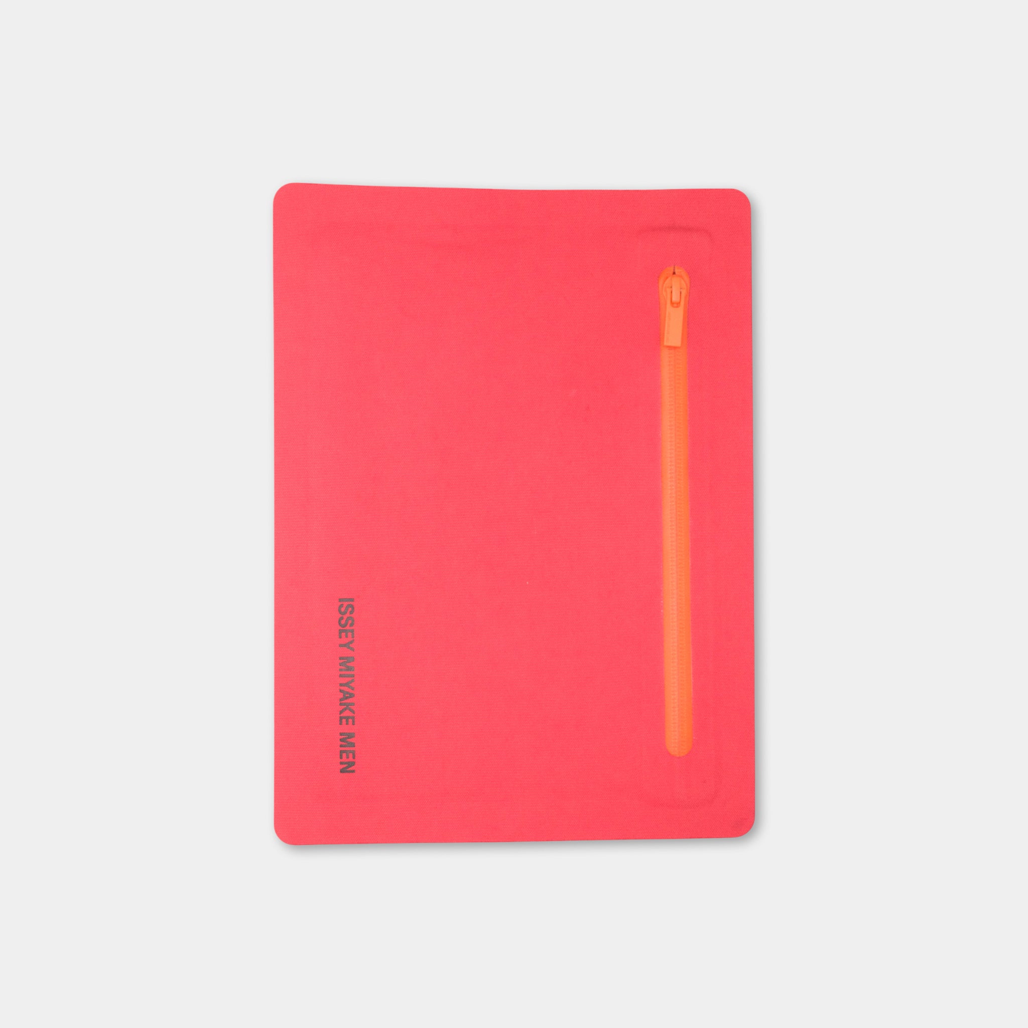 A bright red notebook with a zipper on the right side.