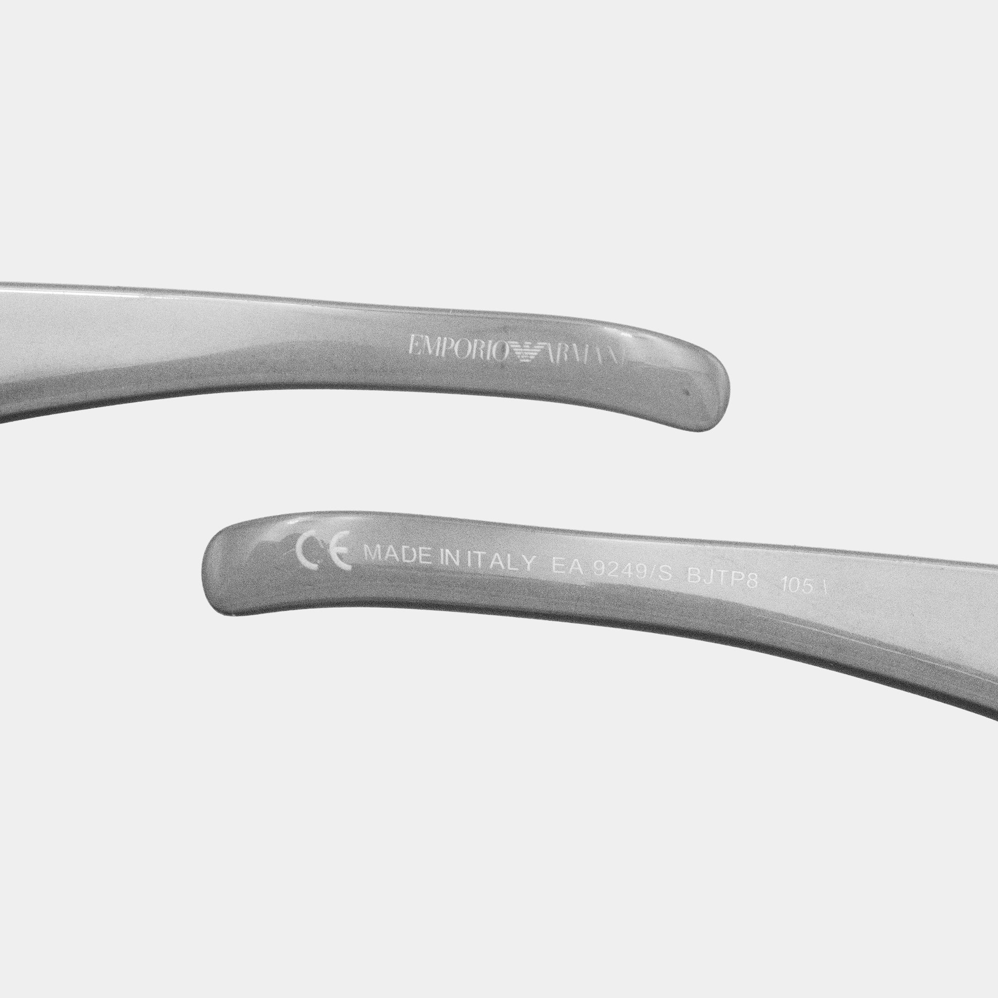 two pairs of sunglasses with the brand name "Emporio Armani" printed on them.