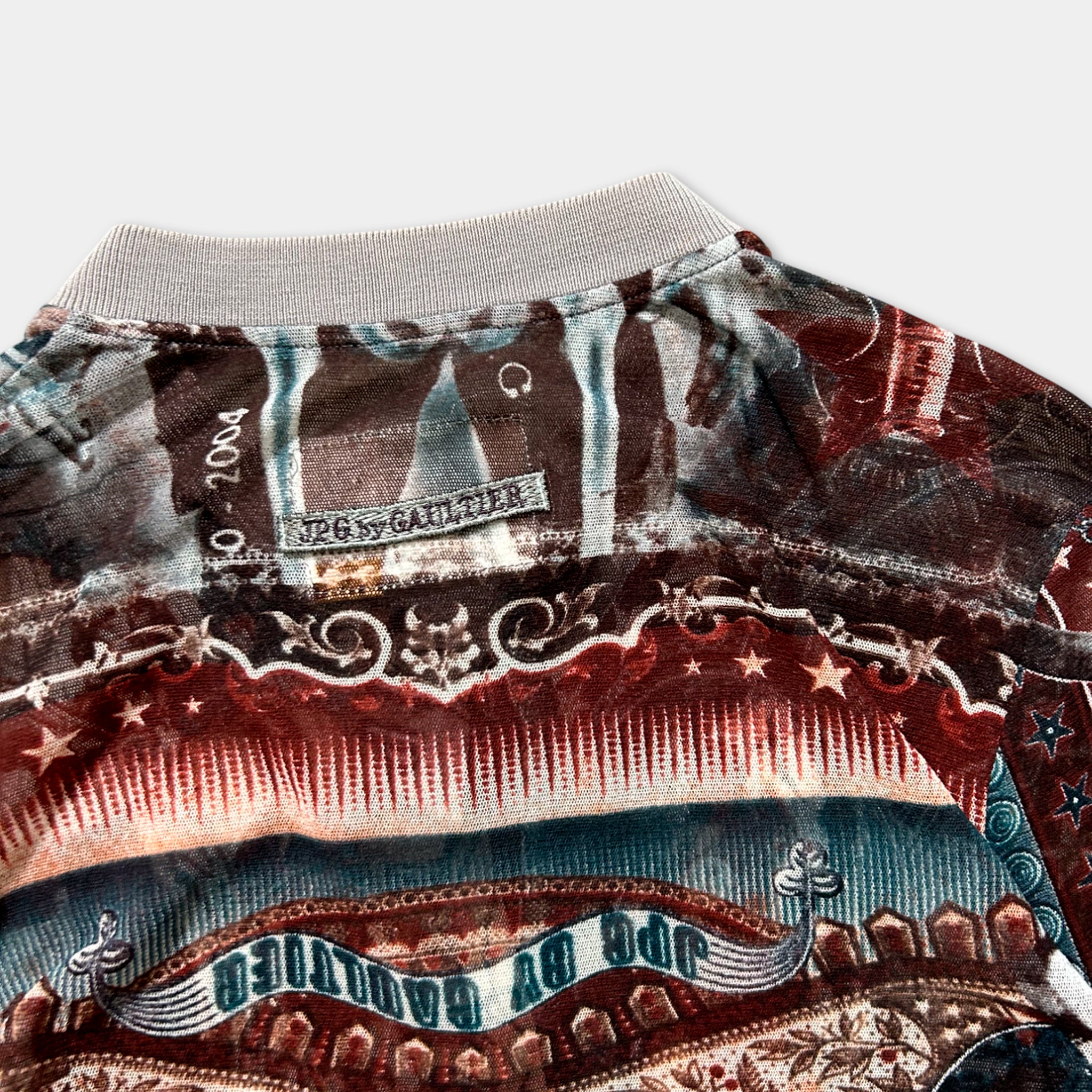 a close-up view of a colorful, patterned jacket with various designs and textures.