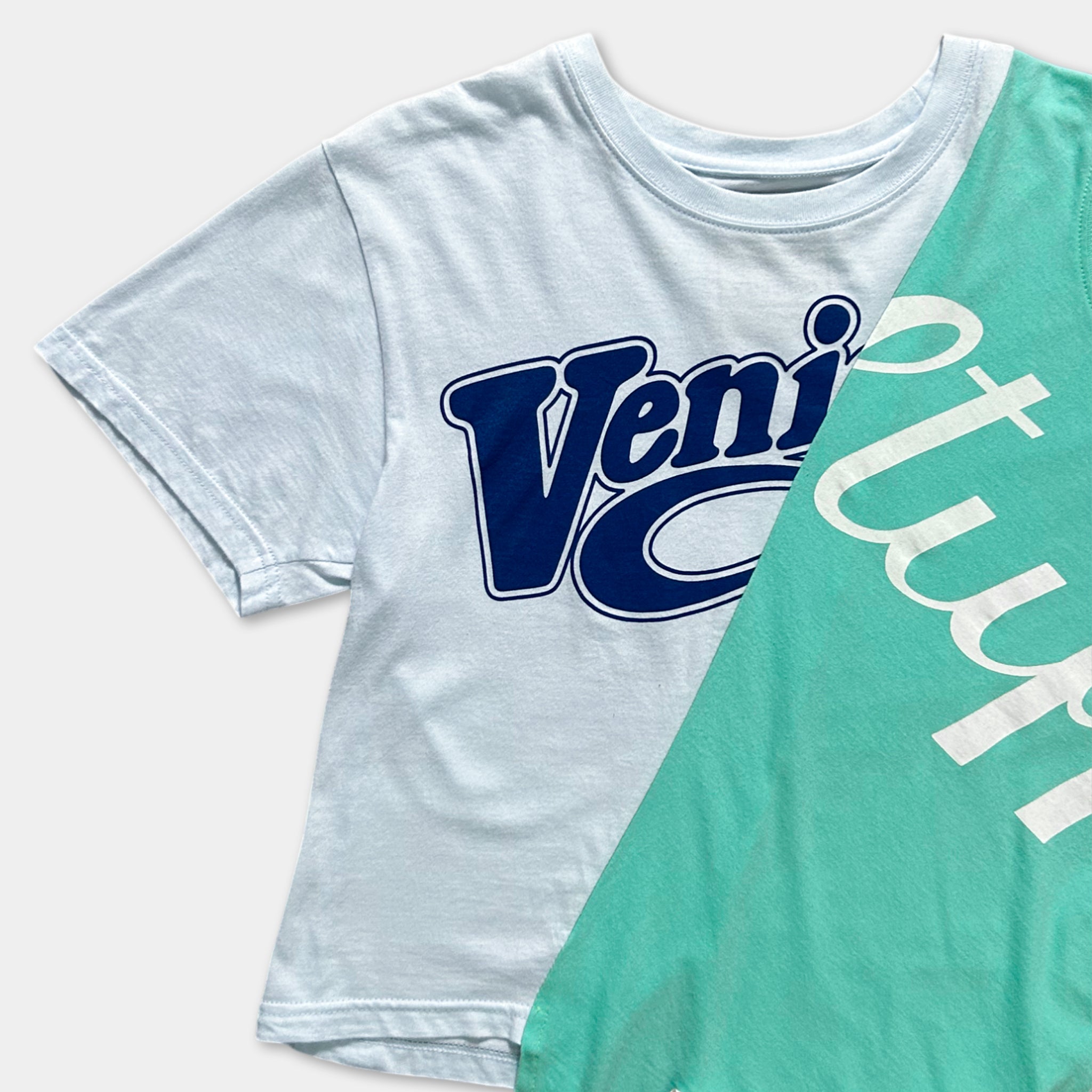 A white t-shirt with a blue logo and a teal tank top with white text on it.