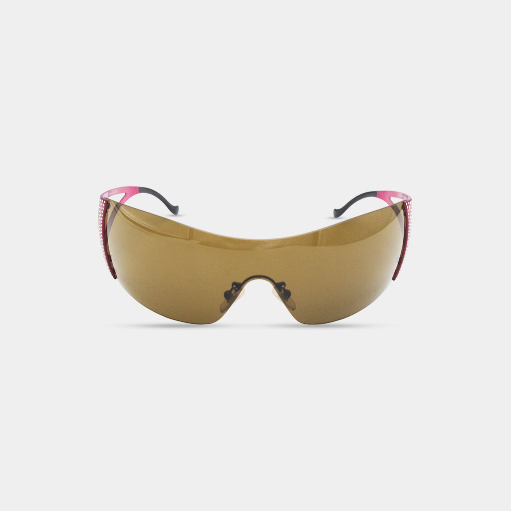 A pair of brown sunglasses with pink accents, featuring a curved frame and dark lenses.