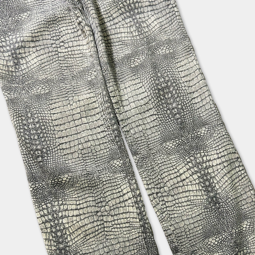 a pair of gray pants with a distinctive crocodile skin pattern.