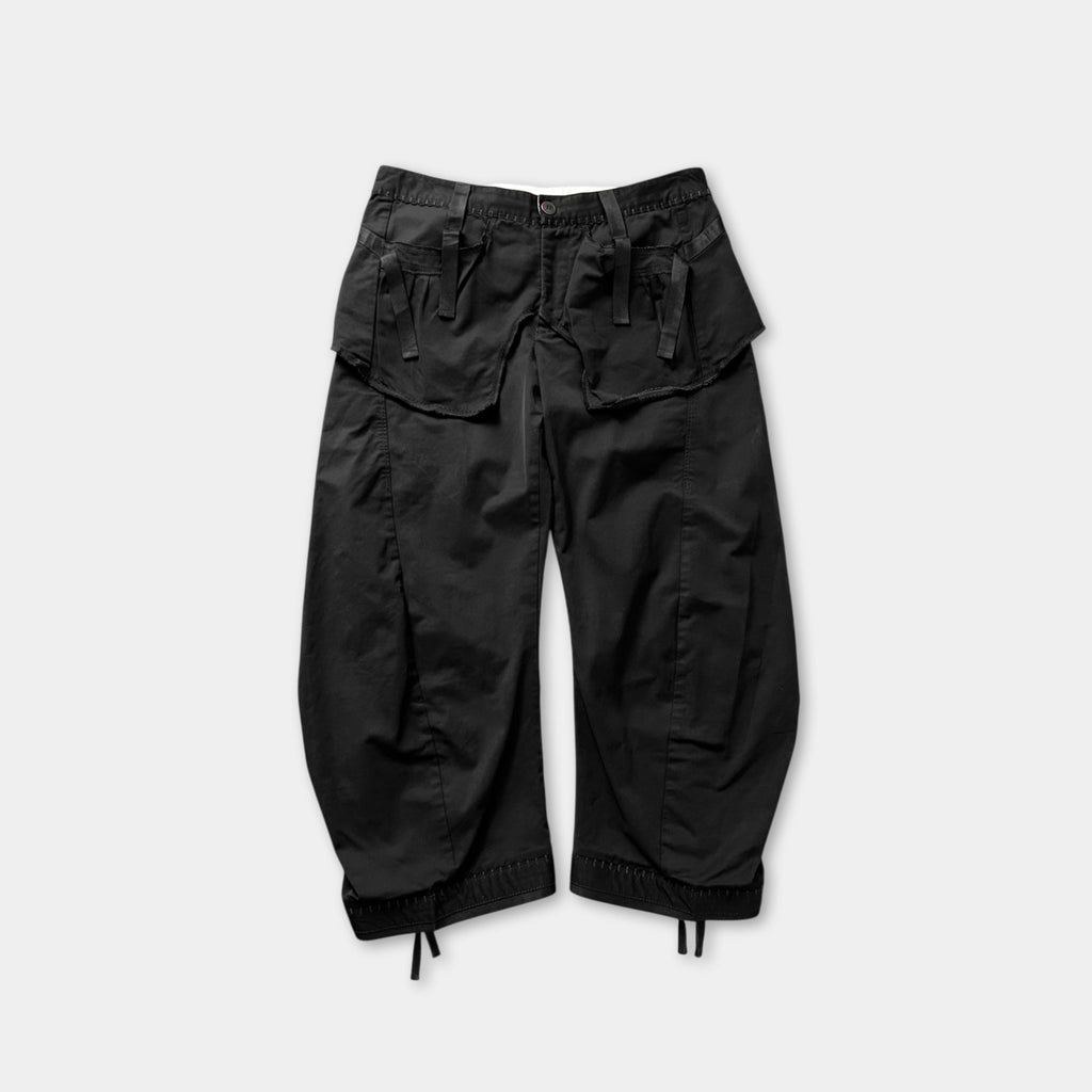 A pair of black cargo pants with multiple pockets.