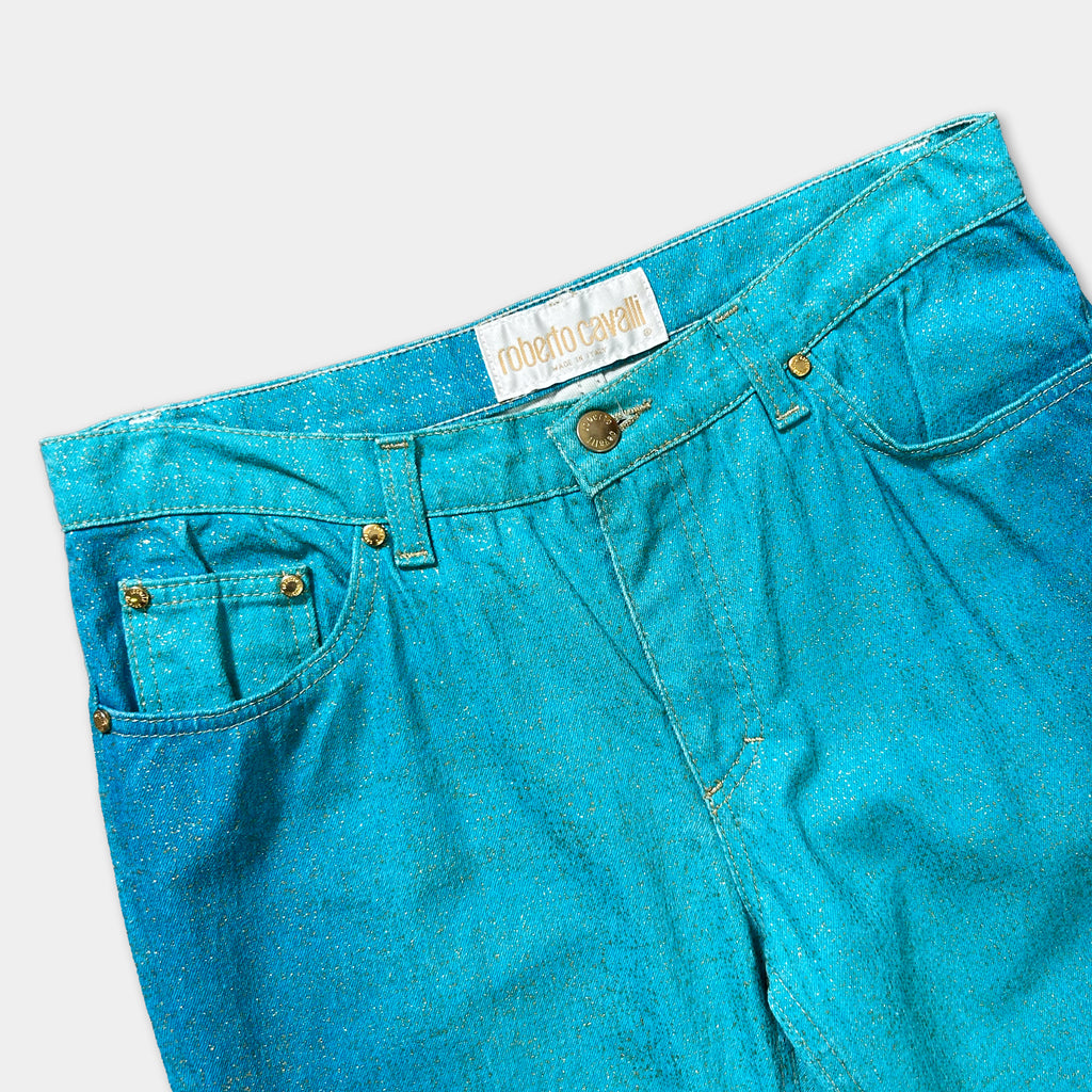 A pair of blue jeans with a glittery, sparkly texture.