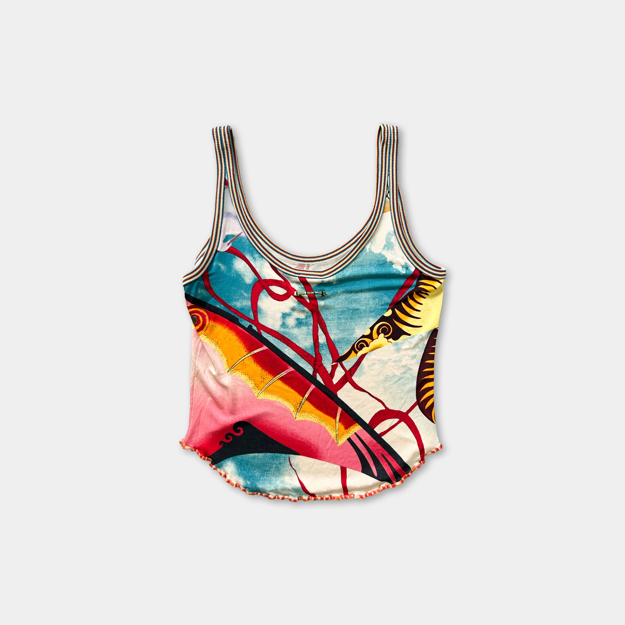 A colorful tank top with a vibrant abstract pattern, featuring a mix of red, yellow, blue, and orange colors.