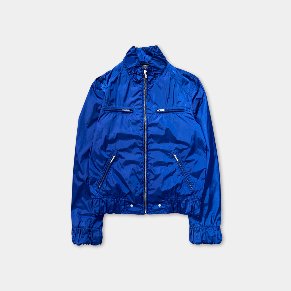 A bright blue jacket with a zipper and pockets, displayed against a plain background.