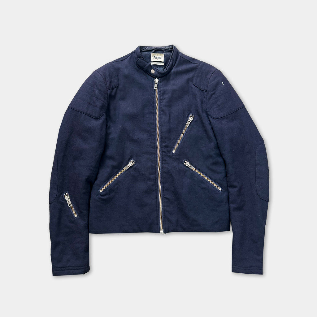 A navy blue jacket with multiple zippers and pockets, displayed against a white background.