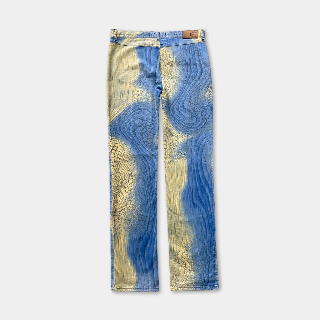 A pair of blue and yellow patterned jeans with a distinctive design.