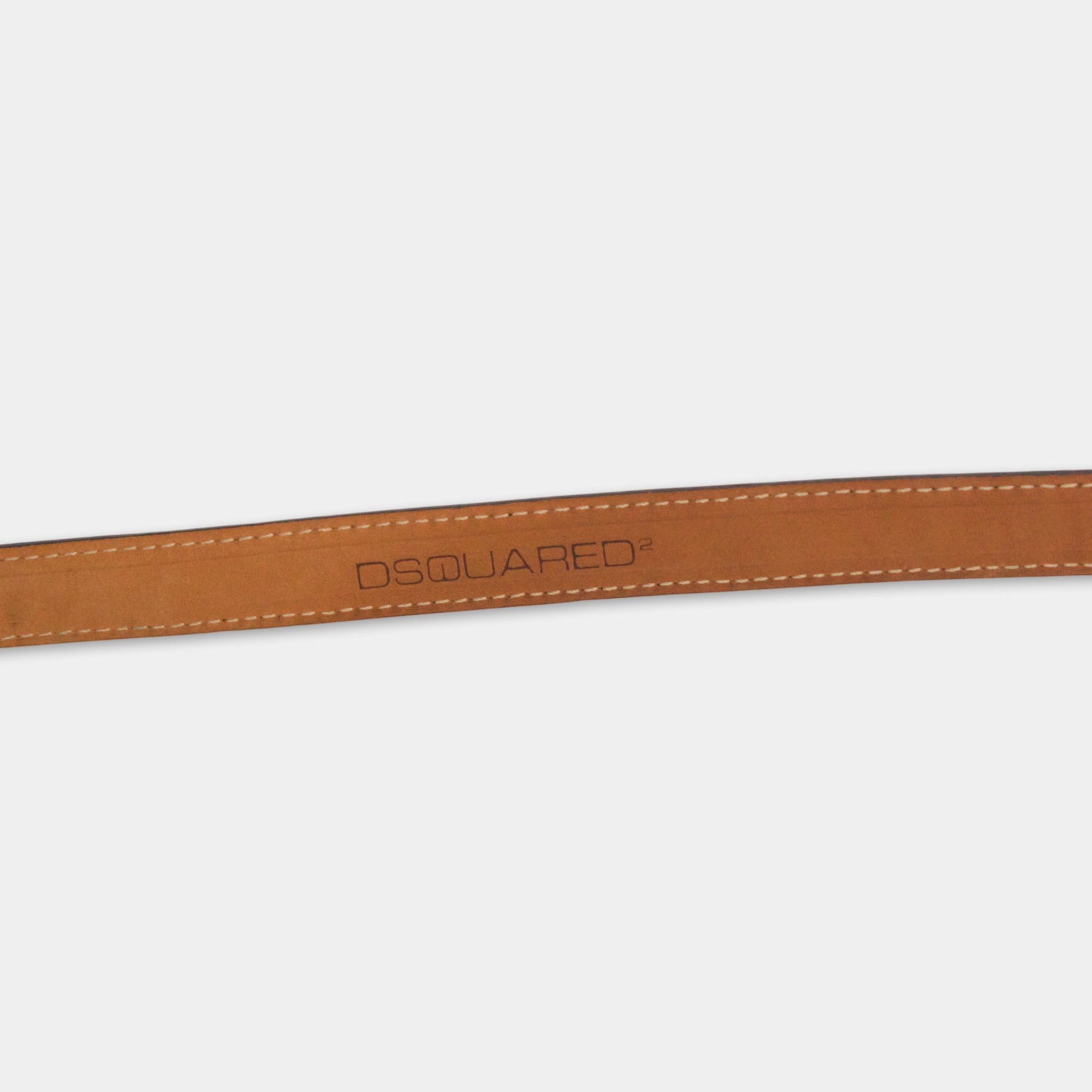 A brown leather belt with the D Square logo printed on it.