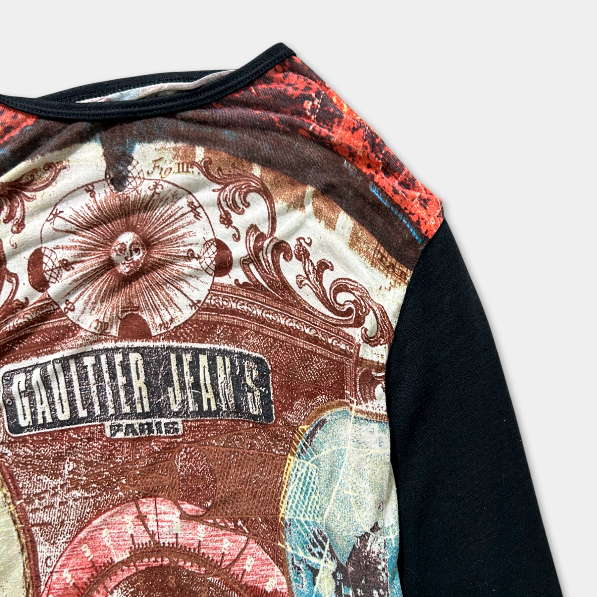 a close-up view of a colorful, patterned shirt with a graphic design on the front.