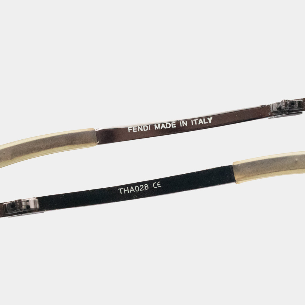 a pair of Fendi sunglasses with the text "FENDI MADE IN ITALY" printed on the frame.