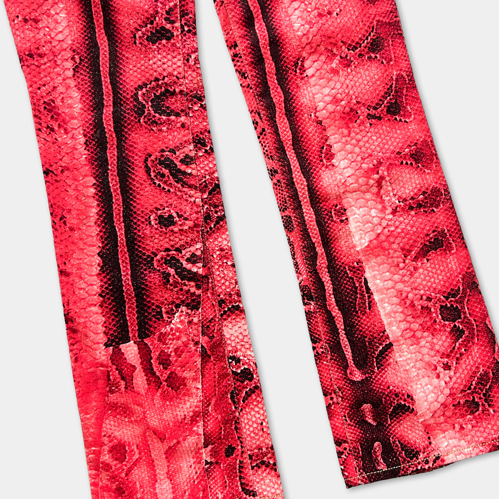a pair of red and black patterned pants, with the pants appearing to be made of a shiny, textured material.