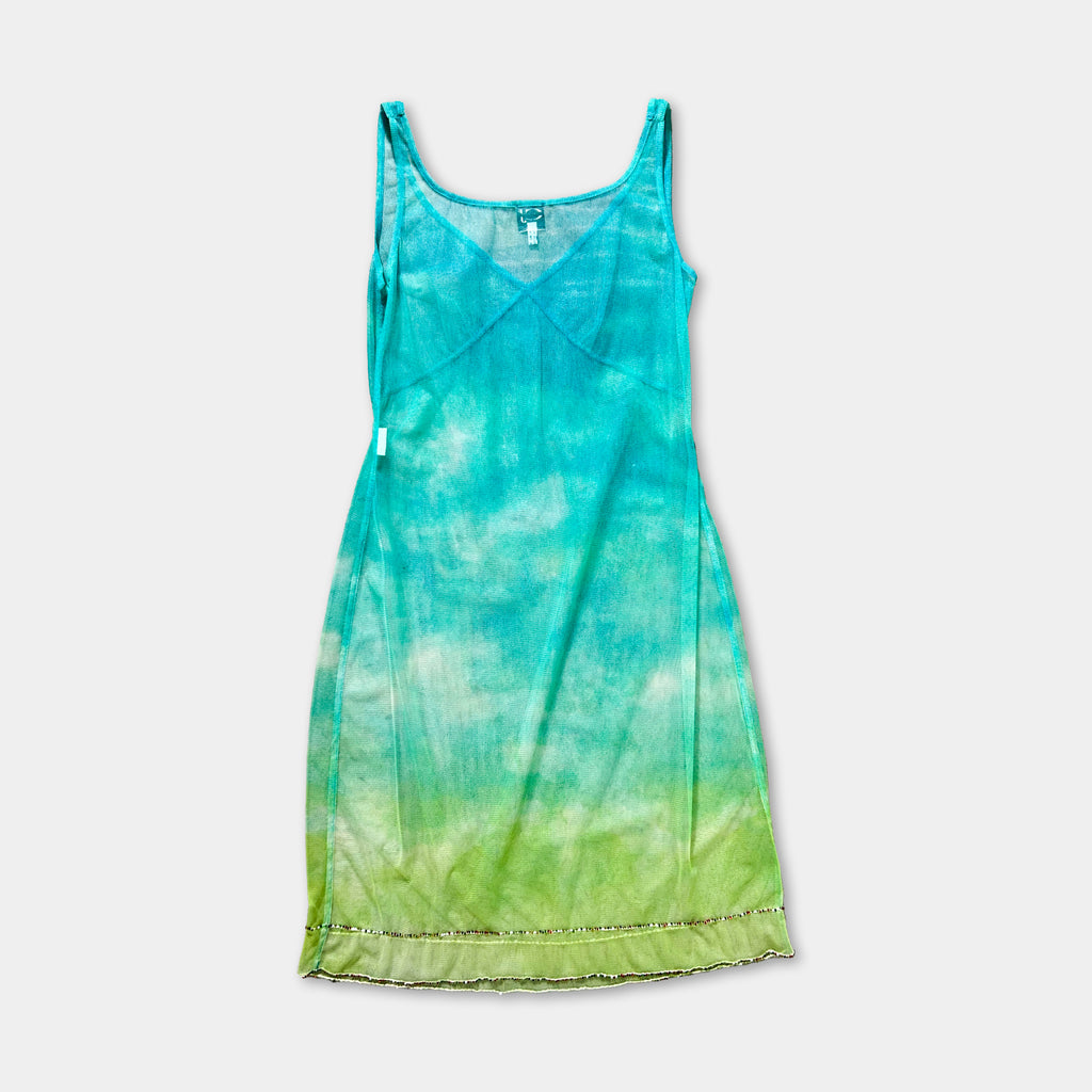A turquoise and green tie-dye dress with a tank top-style neckline and a ruffle trim at the bottom.