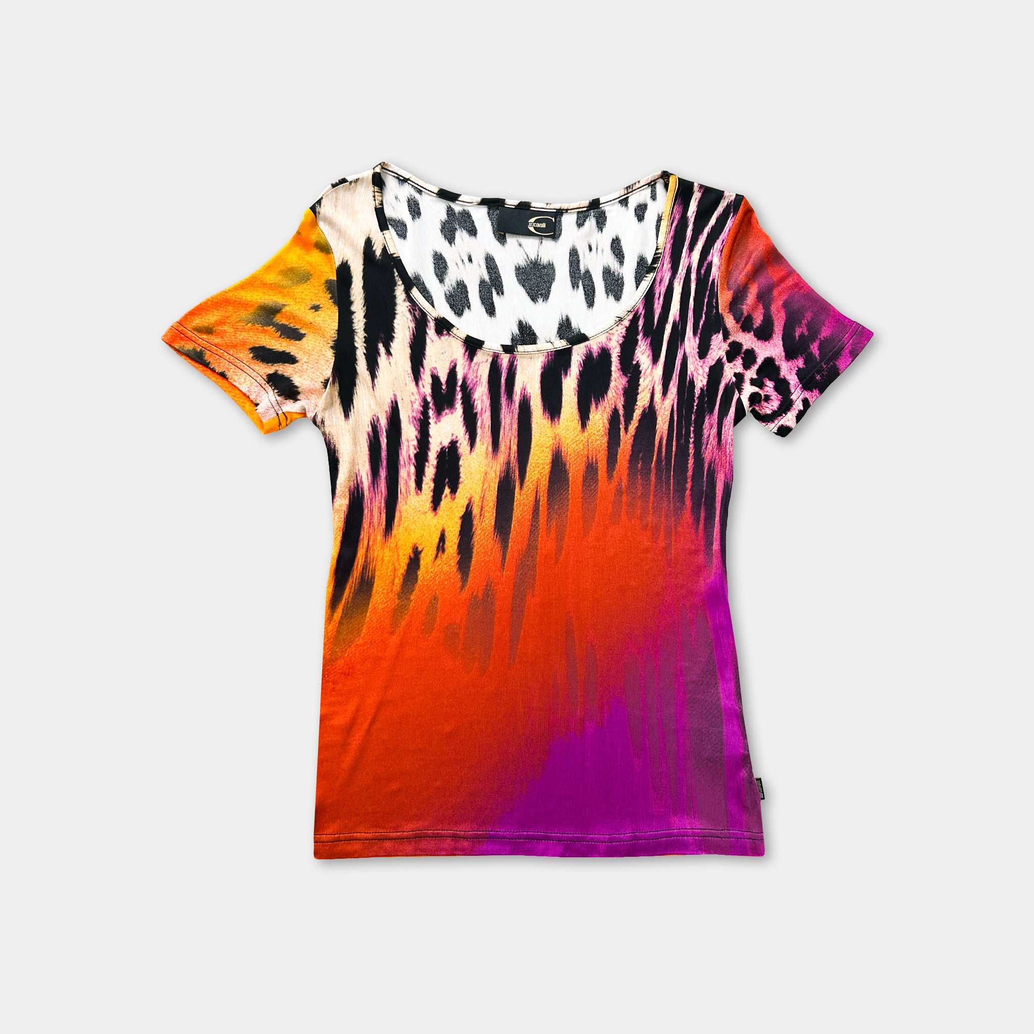 a colorful, patterned t-shirt with a vibrant mix of orange, pink, purple, and black colors.
