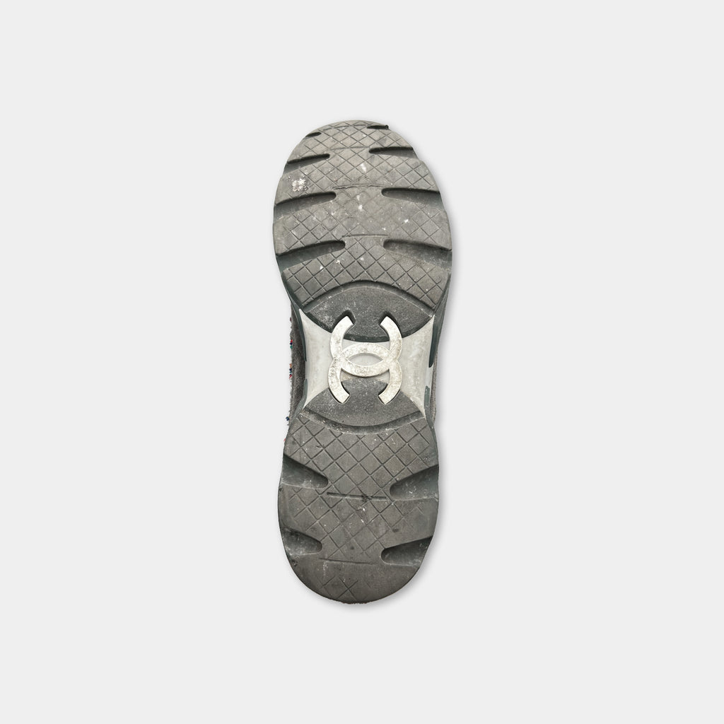 the sole of a shoe against a plain background.