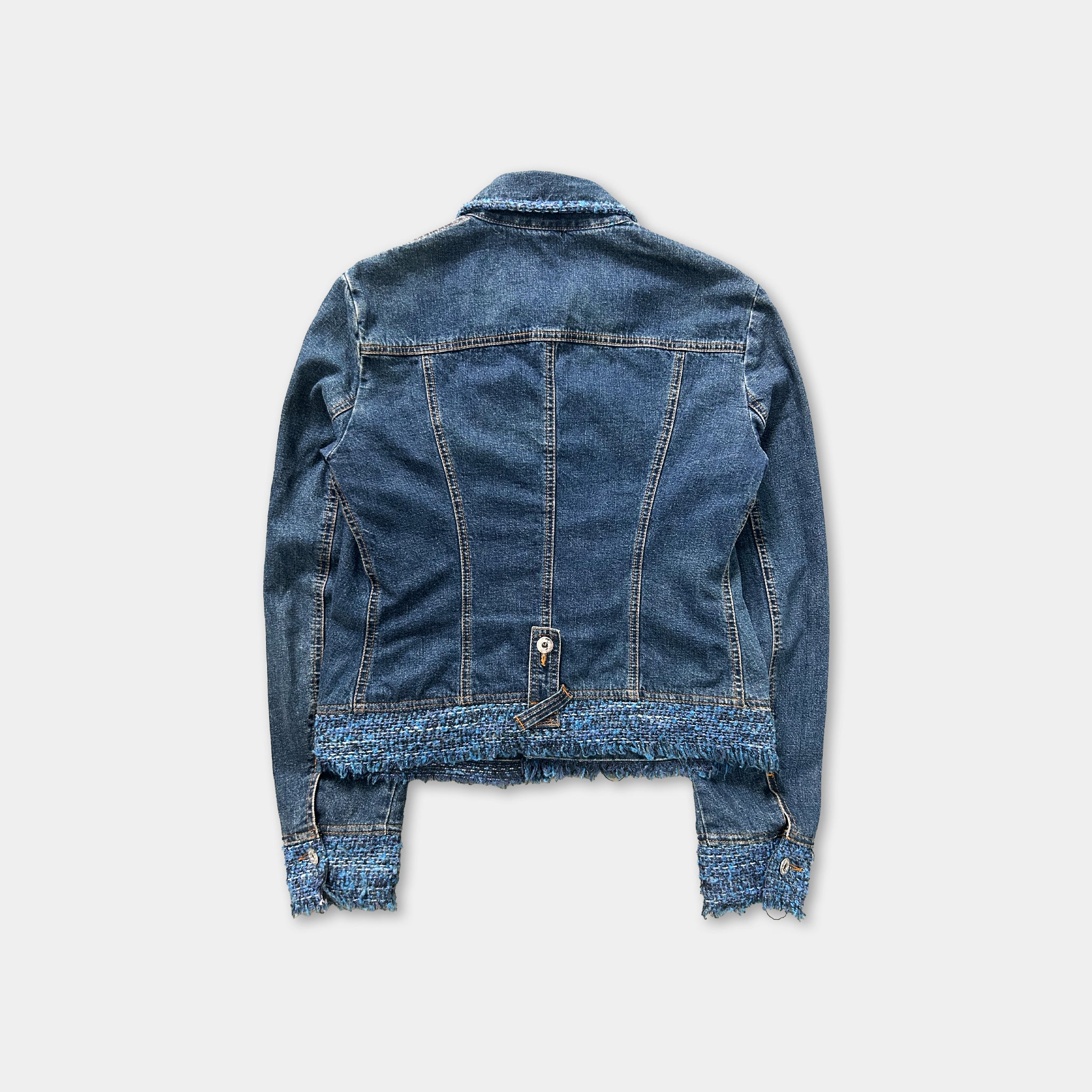 A denim jacket with frayed edges and a blue trim, displayed against a plain white background.