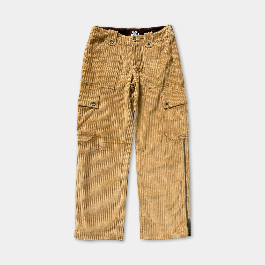 A pair of tan corduroy cargo pants with multiple pockets and a zipper detail.