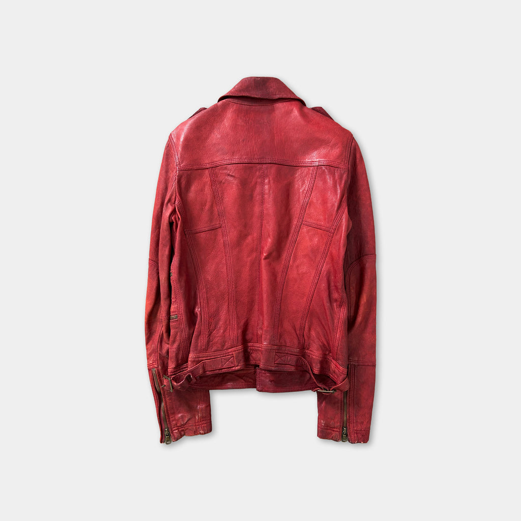 A red leather jacket is displayed against a white background.