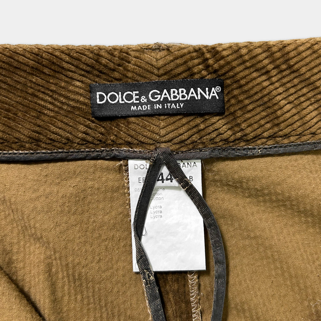 a close-up view of a label on a piece of clothing, specifically a pair of brown corduroy pants.