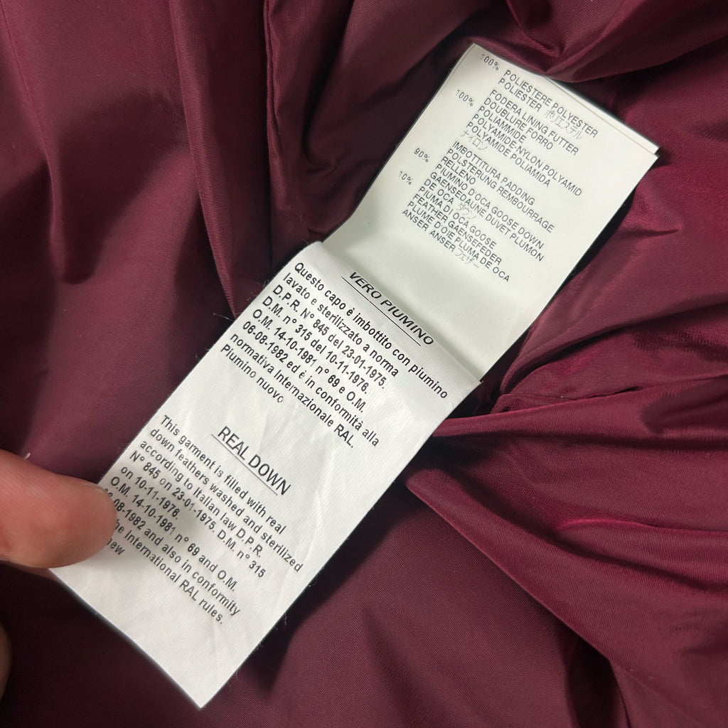 a close-up of a fabric label with text, likely providing information about the product, such as the material, care instructions, and manufacturer details.
