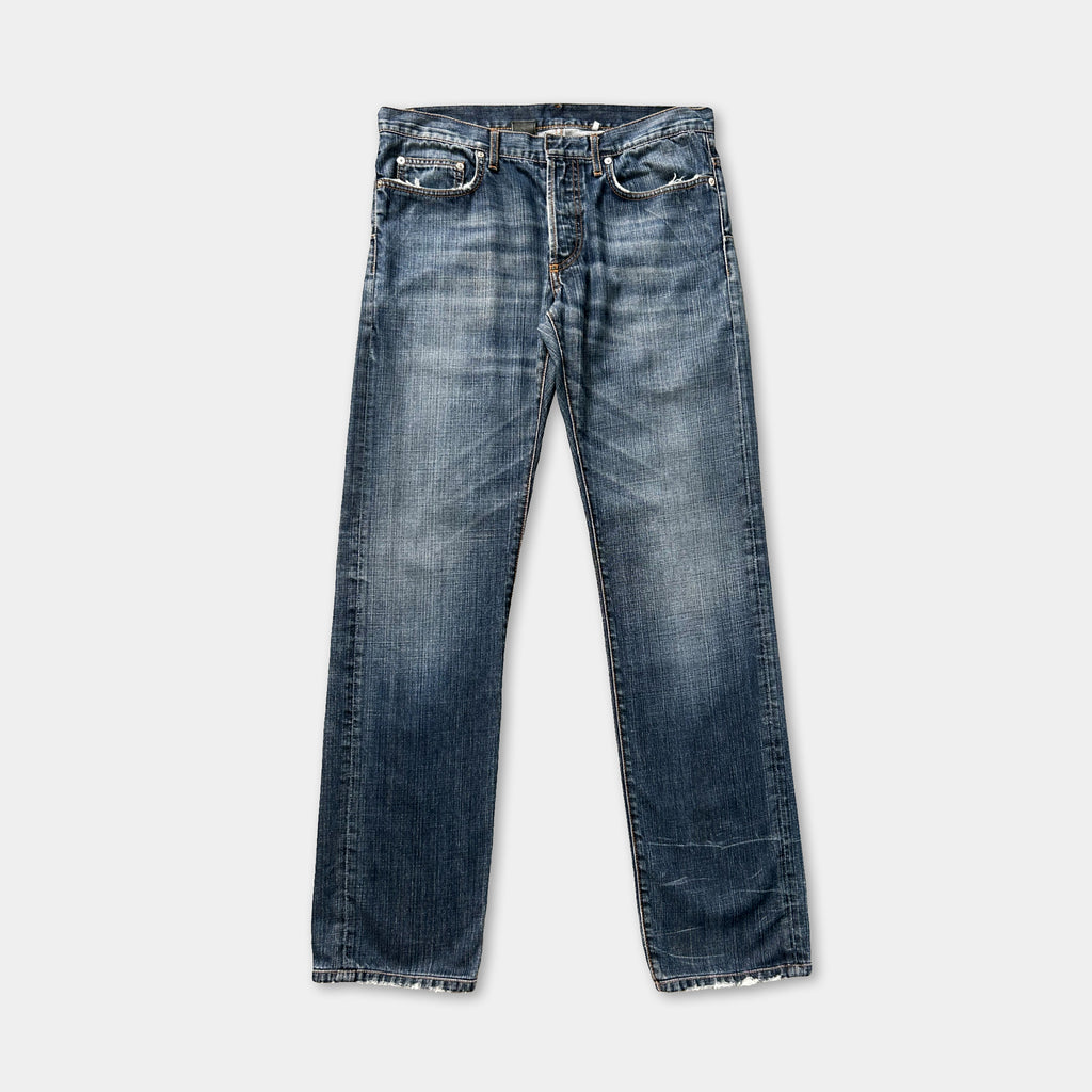 A pair of blue jeans with a classic design, featuring a button closure and a relaxed fit.