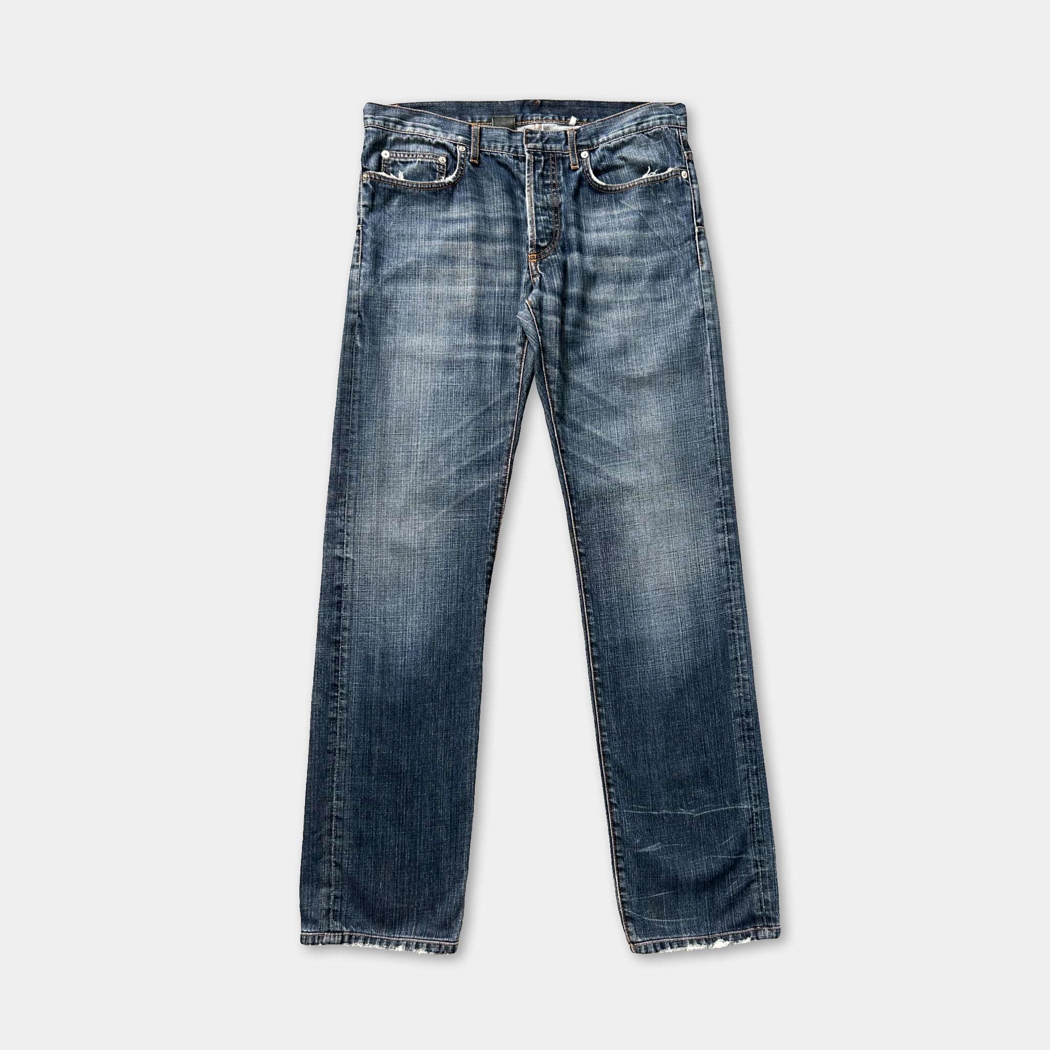 A pair of blue jeans with a classic design, featuring a button closure and a relaxed fit.