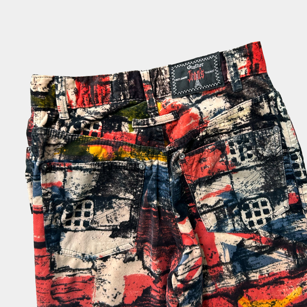 a pair of colorful, patterned jeans with a bold, abstract design.
