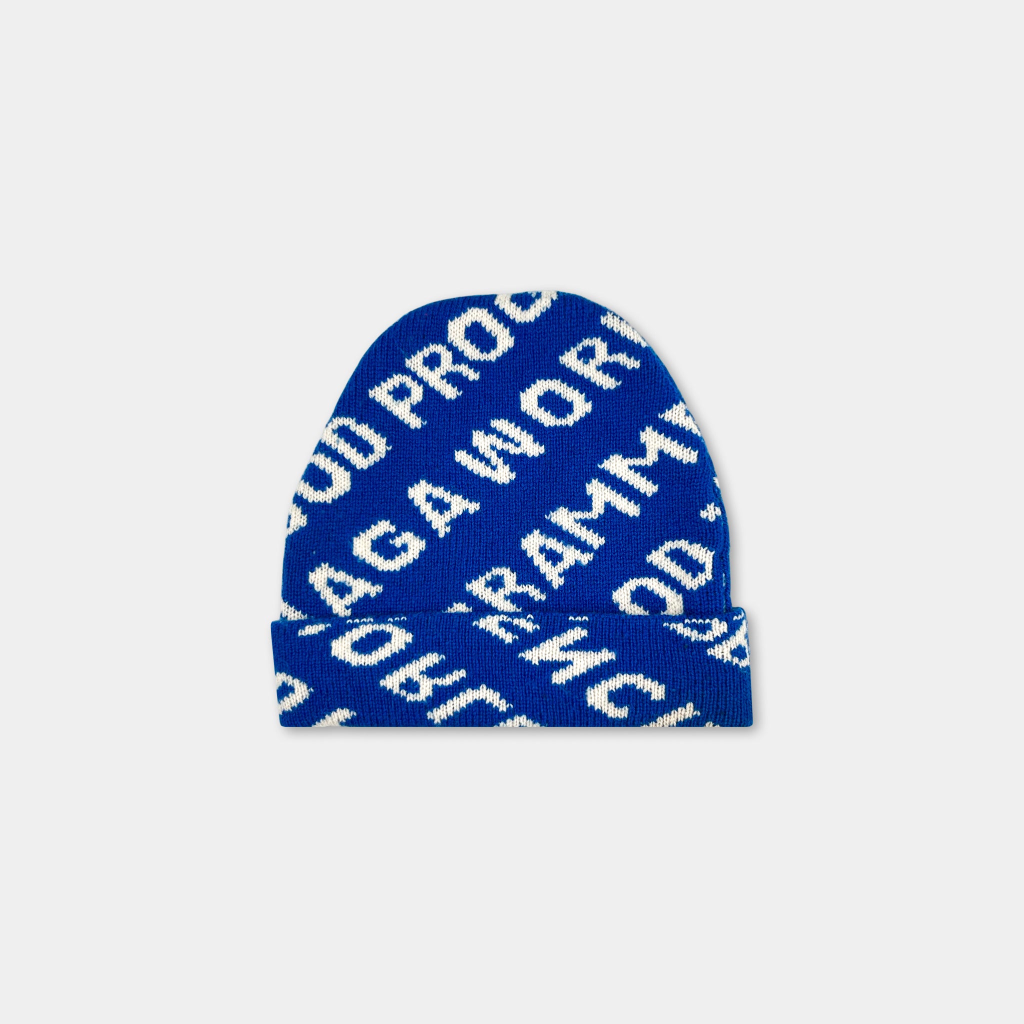 A blue knit beanie with white text on it.