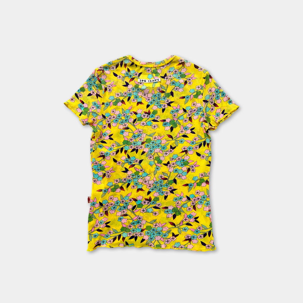 a yellow t-shirt with a floral print pattern.
