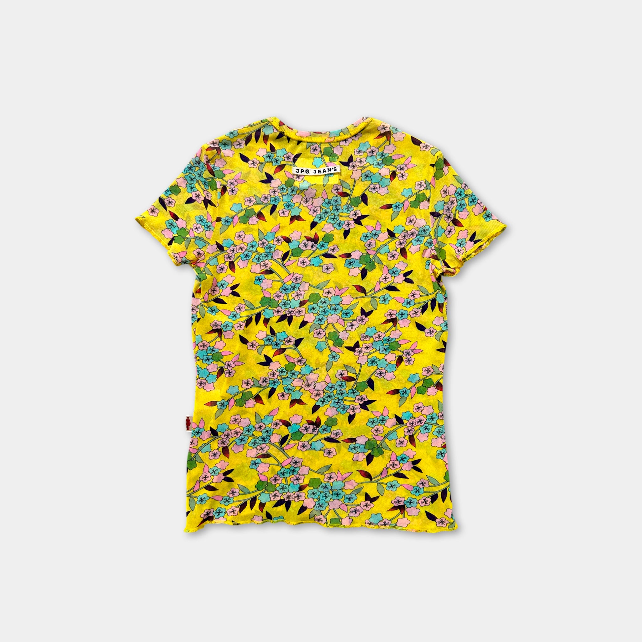 a yellow t-shirt with a floral print pattern.