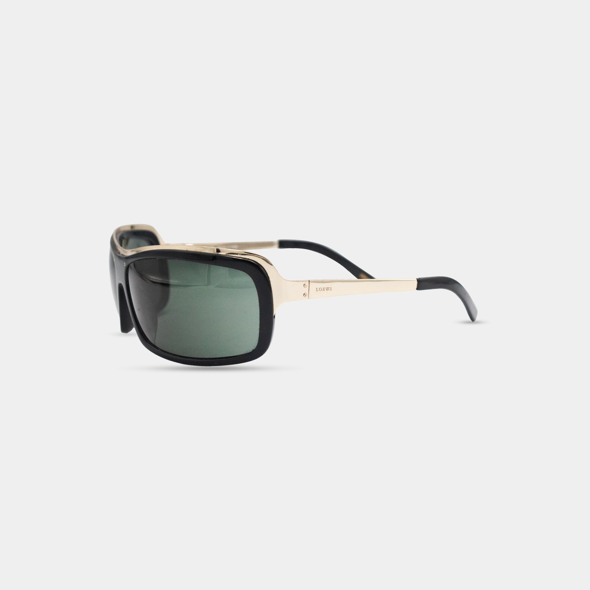 A pair of black and gold sunglasses with dark lenses.