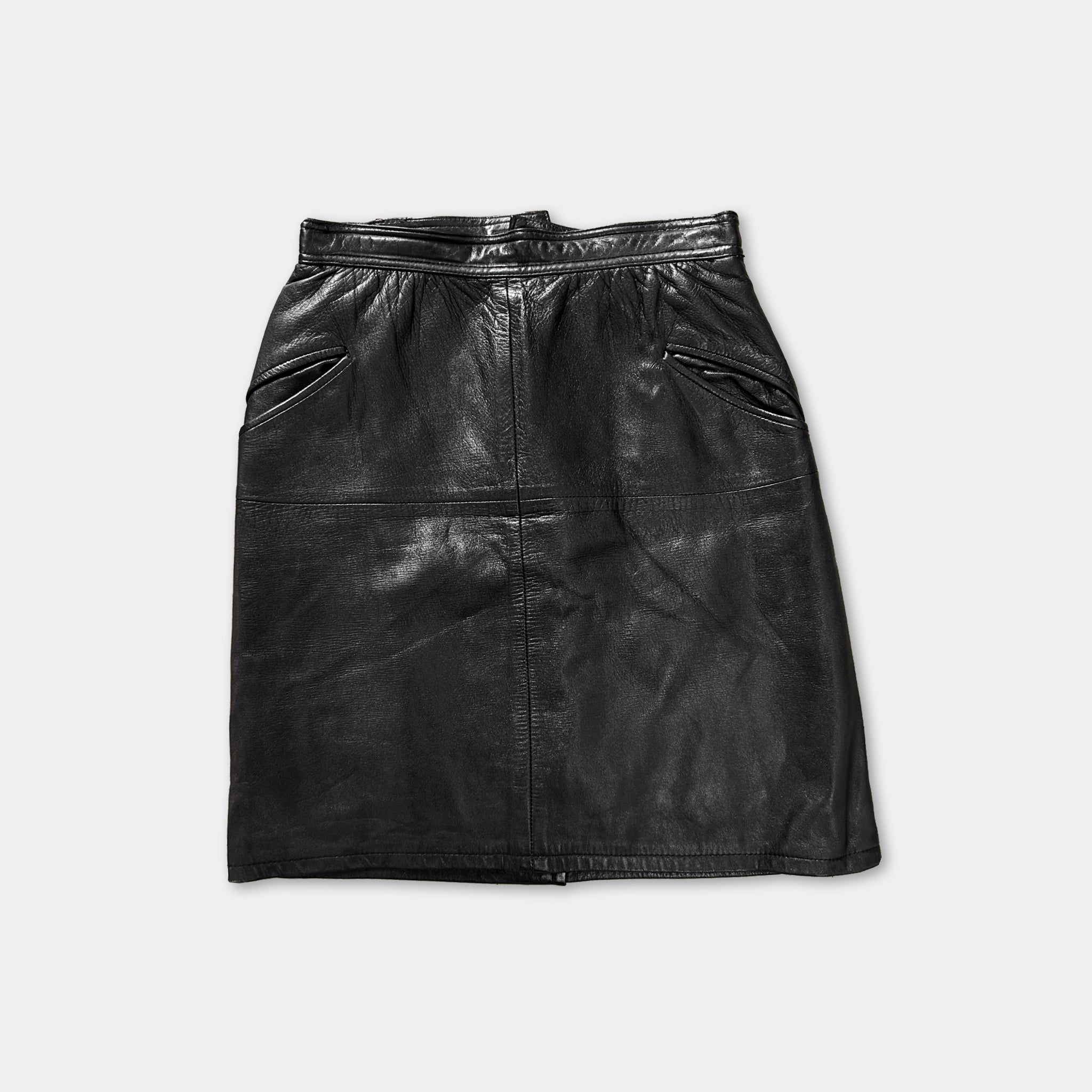 A black leather skirt with a belt and pockets.