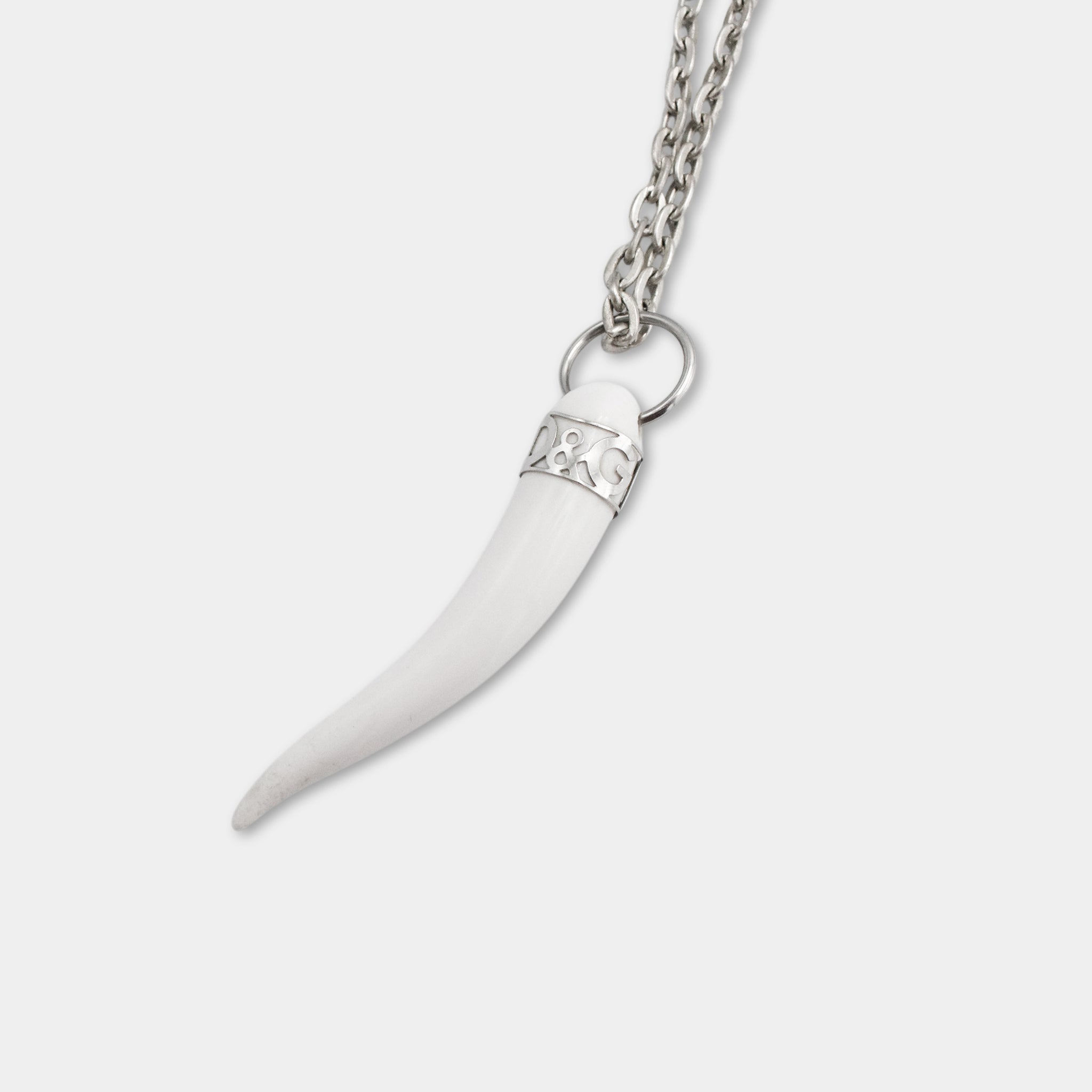 A white, curved pendant with a chain attached to it.