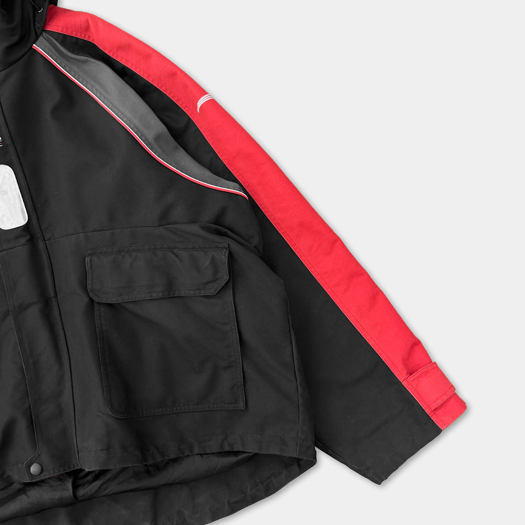 A black and red jacket with a red stripe on the sleeve.