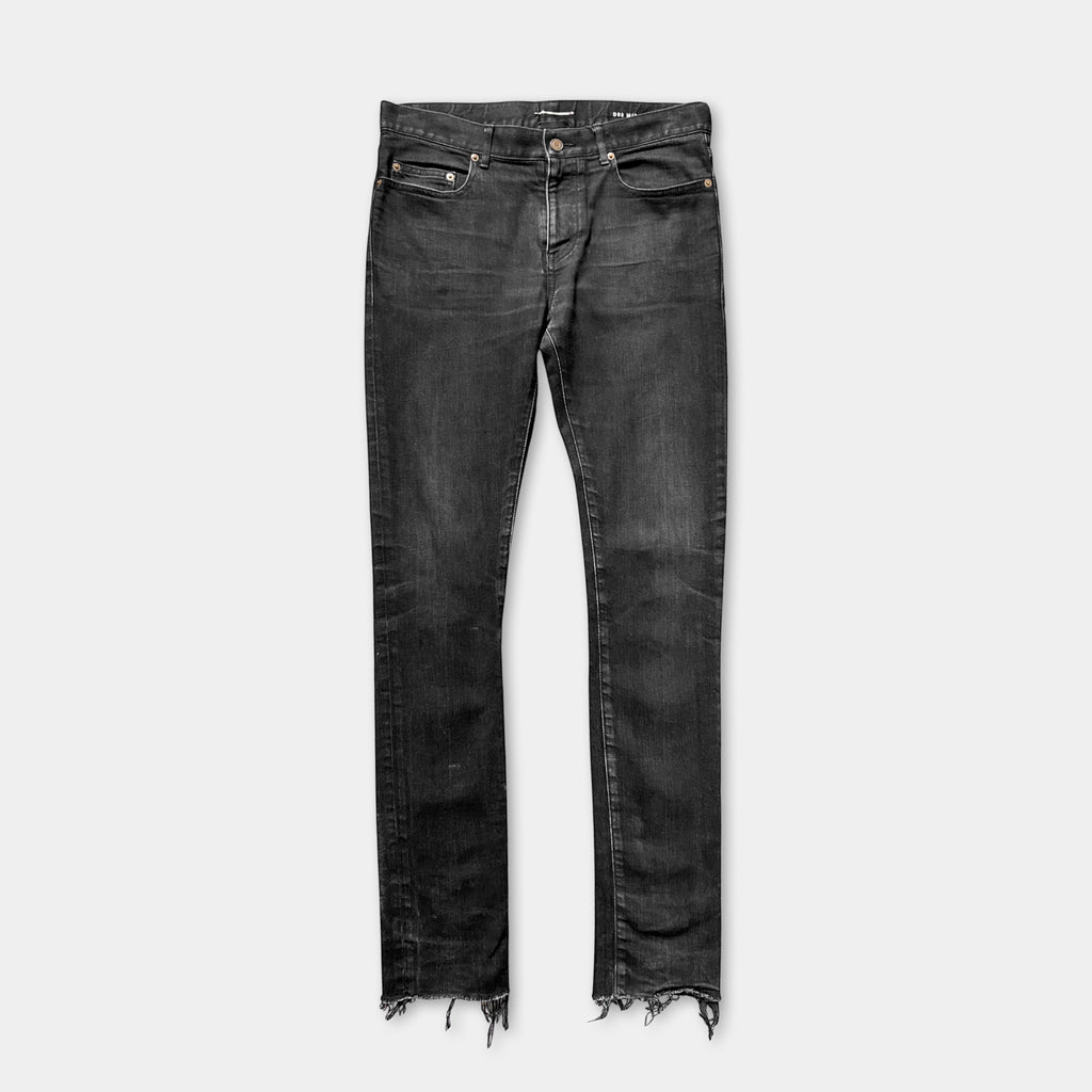 A pair of black jeans with a frayed hem and two pockets.