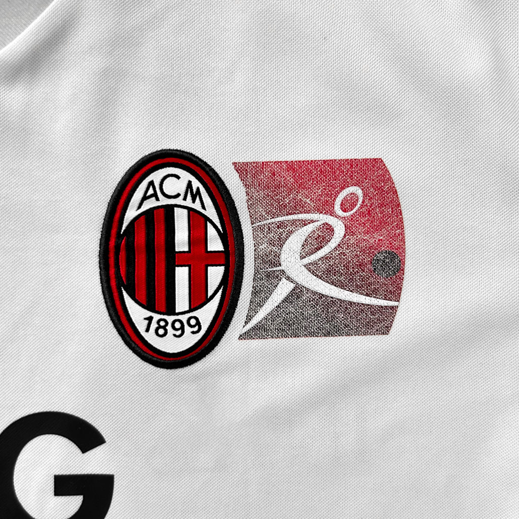 the logo of a sports team, which appears to be a soccer club. The logo consists of a red and black oval with the letters ACM inside, and a red and white rectangular shape with a stylized figure inside.