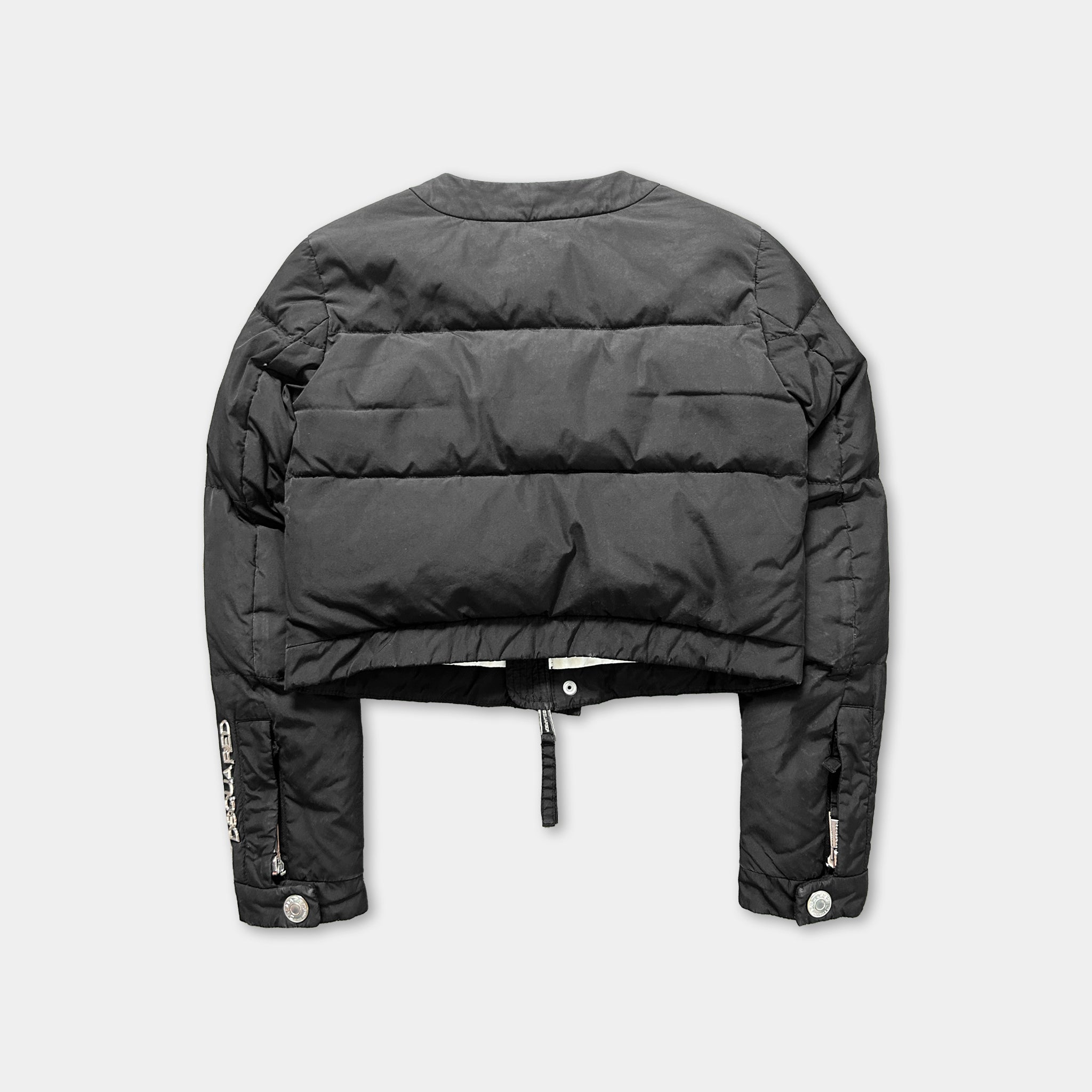 A black puffer jacket with a zipper and buttons, laid out against a white background.