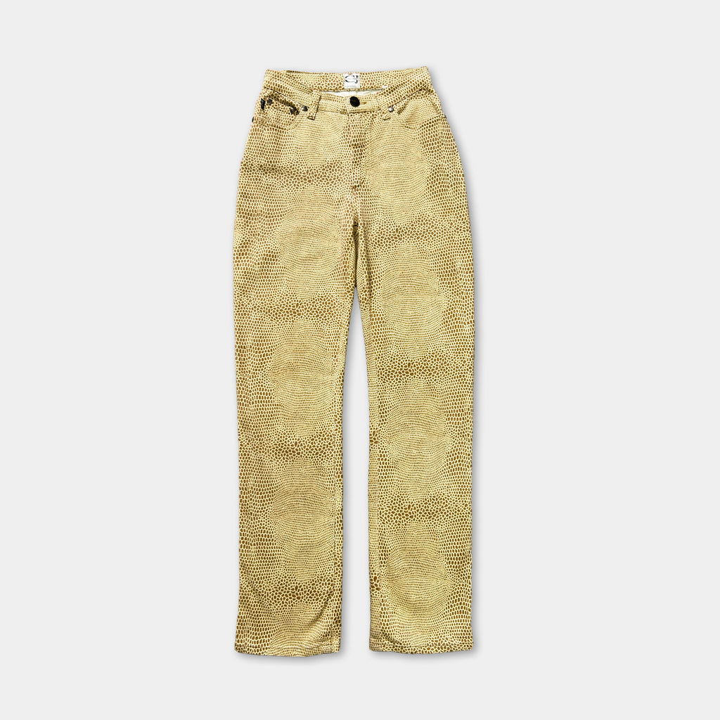 A pair of tan-colored jeans with a patterned design.