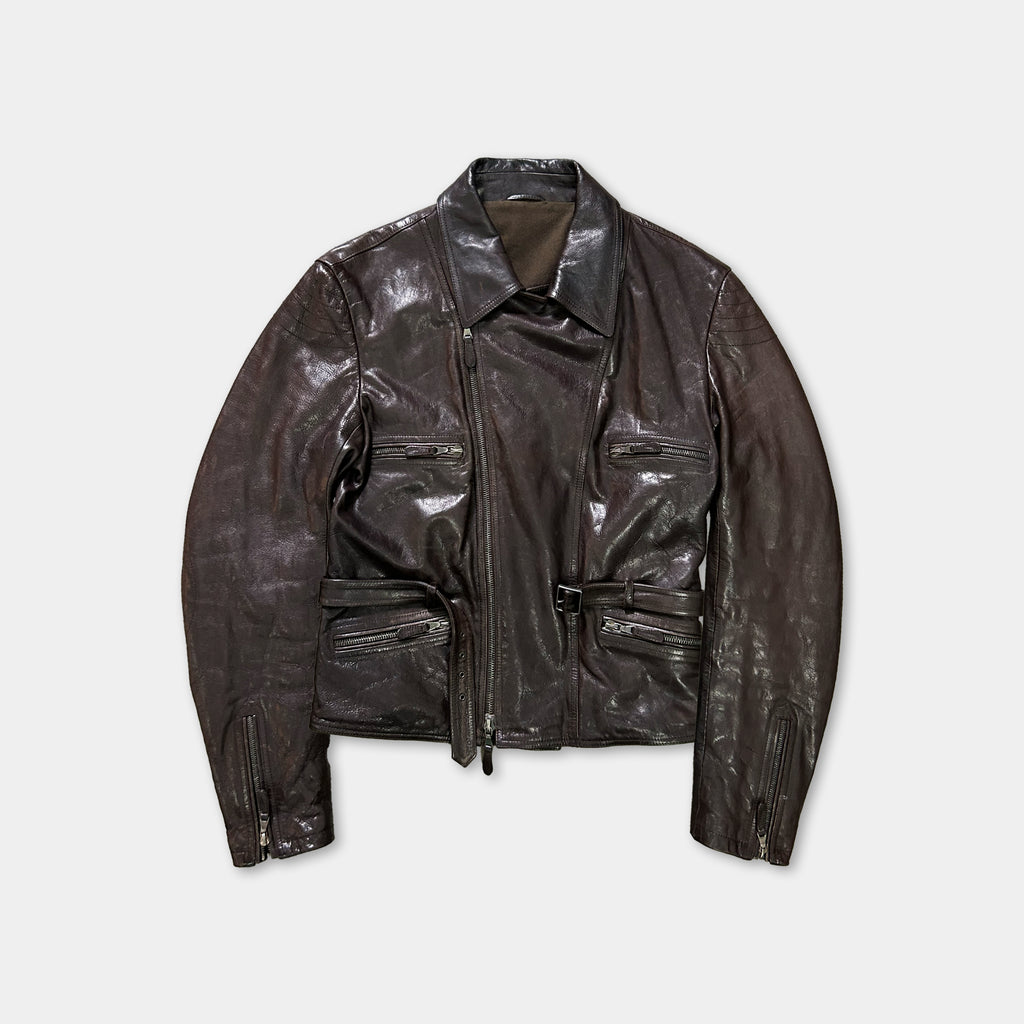 A brown leather jacket with multiple pockets and zippers, displayed against a white background.